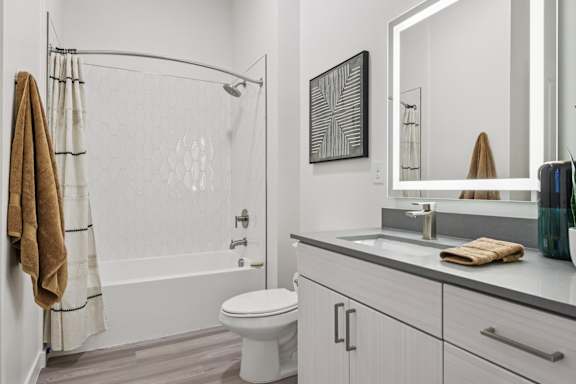 A White Bathroom with Towel at Coya Apartments, Las Vegas