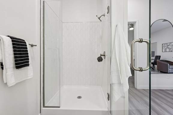 Bathroom with Glass Shower Door at Coya Apartments, Las Vegas