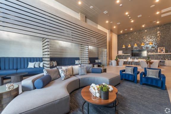 a lobby with couches and chairs and a table at Aura Vegas Apartments, Las Vegas, 89103