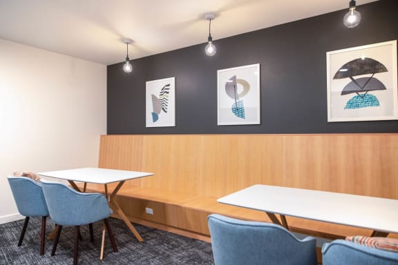Meeting room with two tables at Hana Apartments, Hillsboro, Oregon