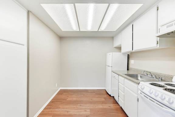 Kitchen with White Appliances at Woodside Senior Apartments (55+), Ontario