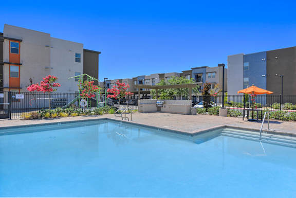 Swimming pool with spa and lounge area at Anton Arcade Apartments, Sacramento, CA 95825