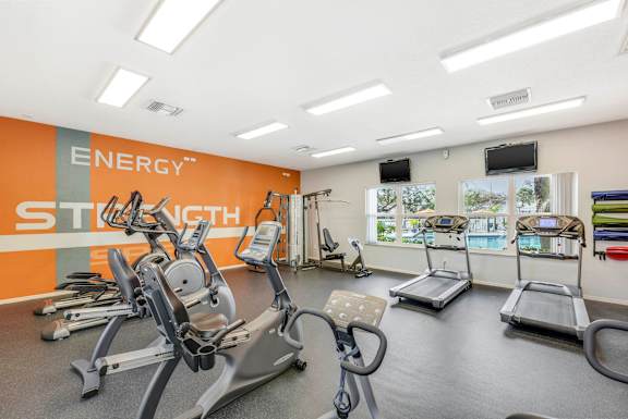 Gym with treadmills at Wellington Woods Apartments, Kissimmee, FL