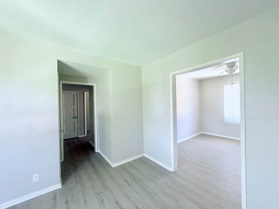 A room with a doorway leading to another room.