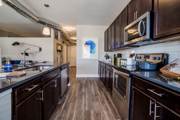 Fully Equipped Kitchen Includes Frost-Free Refrigerator, Electric Range, & Dishwasher at The Congress at Library Square, Indianapolis, IN, Indiana