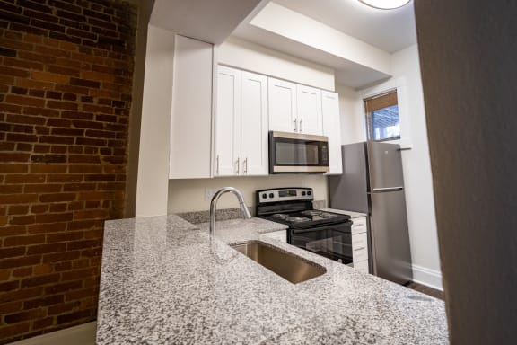 Granite Counter Tops In Kitchen at Lockerbie Court on Mass Ave, Indianapolis, IN