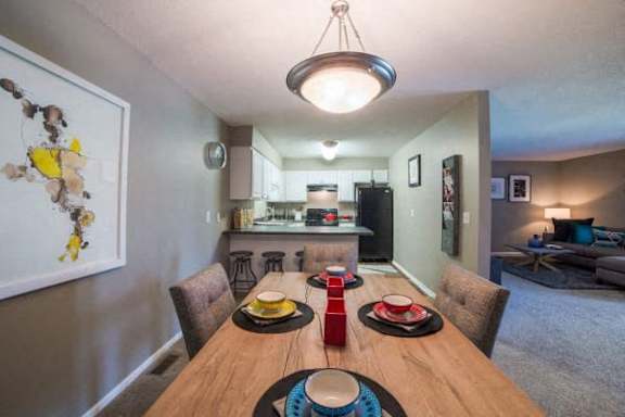 Dining space with comfortable seating at Gramercy Apartments, Indiana