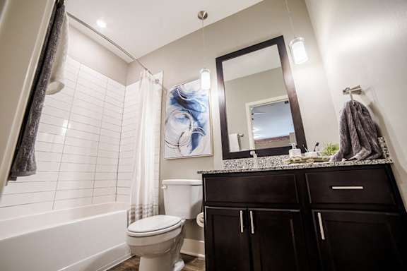 a bathroom with a shower and a toilet and a sink at The Foundry, Indiana