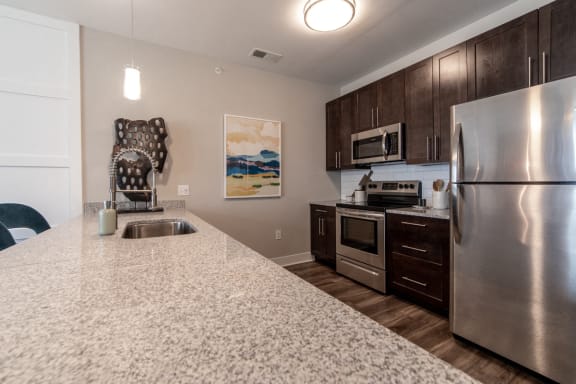 full kitchen with stainless steel appliances at the preserve at greatstone at The Century at Purdue Research Park-Student, West Lafayette