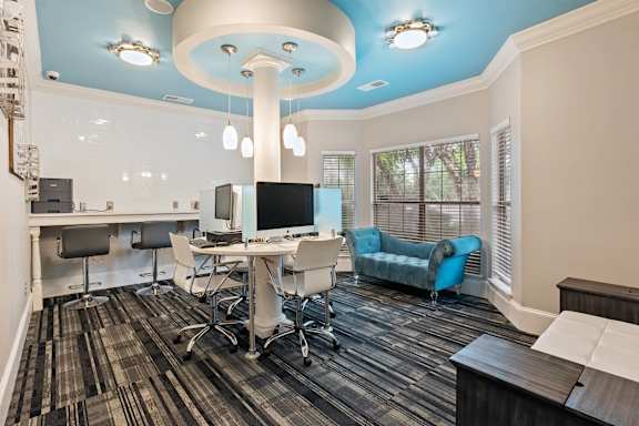 A room with a blue ceiling and a desk with a computer on it at Village at Almand Creek, Georgia 30094