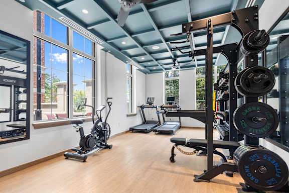 A well-equipped gym with a variety of exercise machines and weightlifting equipment.