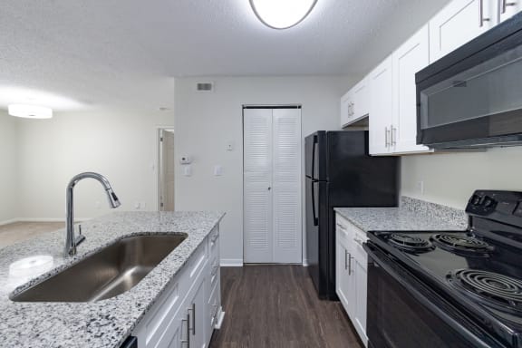 Stainless Steel Sink With Faucet In Kitchen at The Residence at White River Apartments, Indianapolis