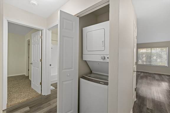 an empty laundry room with a washer and dryer in it at The Winds at Poplar Creek Apartments , Illinois