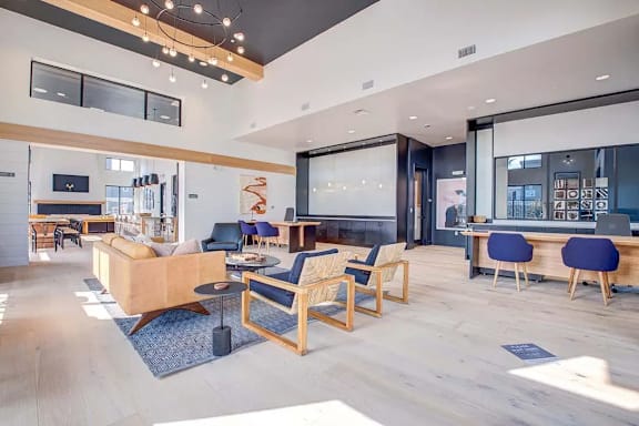 A modern living room with a fireplace and a dining area.