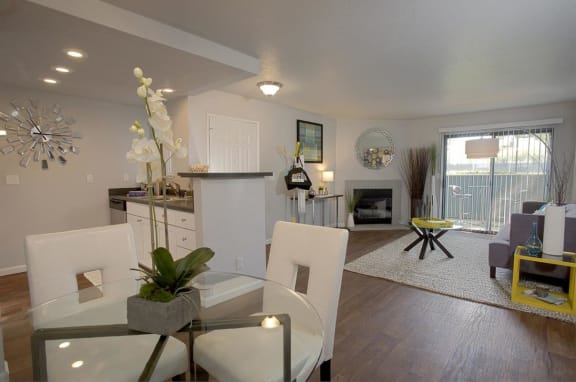 Dining and living room with fireplace at THE EDGE Apartments, California, 95618