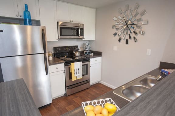 Kitchen with stainless steel appliances at THE EDGE Apartments, California