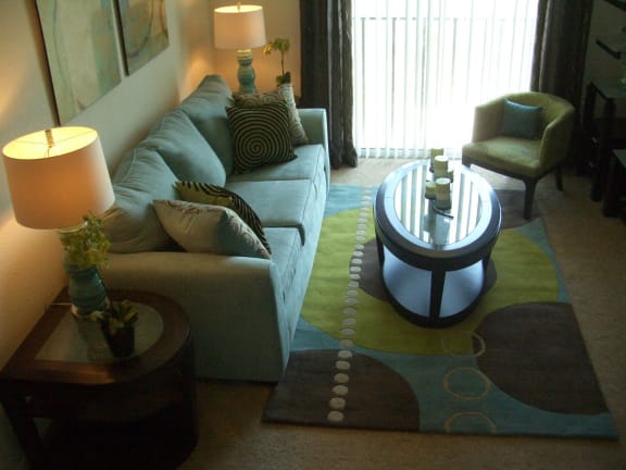 Living room with window at Hawk's Landing Apartments, Fort Myers, FL