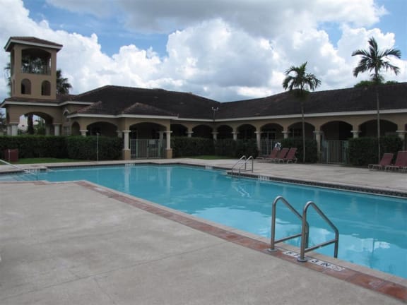 Pool with lounge chairs Eagles Landing in Miami Gardens Florida