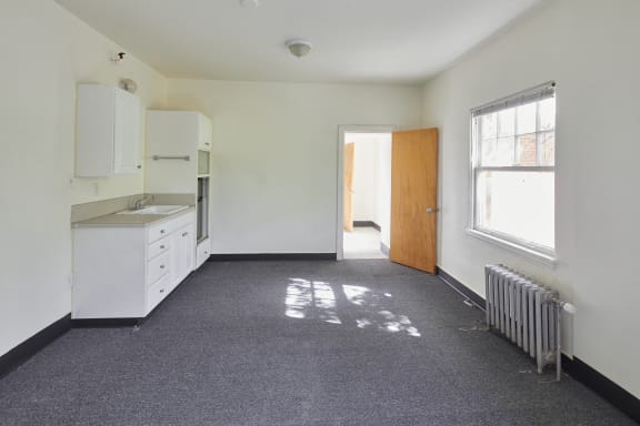 an empty room with a sink and a radiator at MILEPOST 5 Apartments, Oregon, 97213