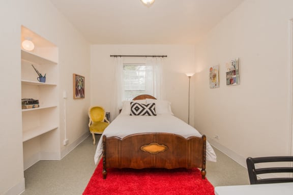 a bedroom with a bed and a window at MILEPOST 5 Apartments, Oregon, 97213
