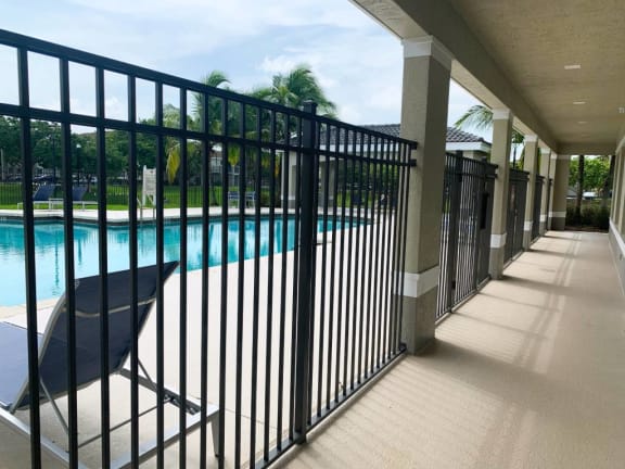 Swimming pool and lounge chairs  at Tuscany Place Apartments, Florida