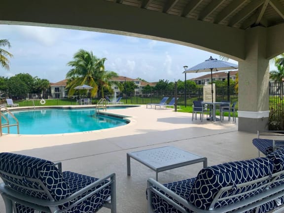 lounge chairs at Tuscany Place Apartments, Homestead , FL