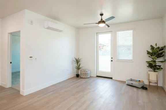 a living room with a ceiling fan and a door at 38° NORTH, Santa Rosa, 95404