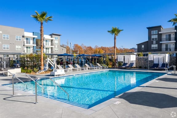 a pool at the district flats apartments in lenexa, ks