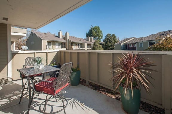Private patio area with seating at KIRKER CREEK, Pittsburg, 94565
