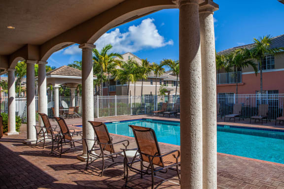 resort style pool with lounge chairs at Preserve at Boynton Beach, Boynton Beach, FL
