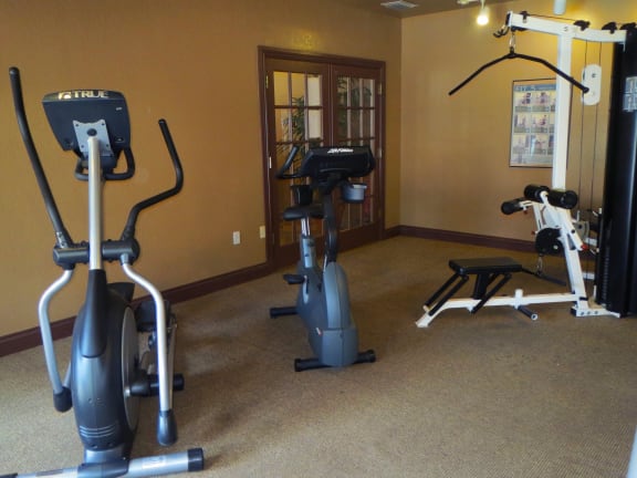 San Marco fitness center with cardio and weight equipment at San Marco Apartments, Ormond Beach, 32174