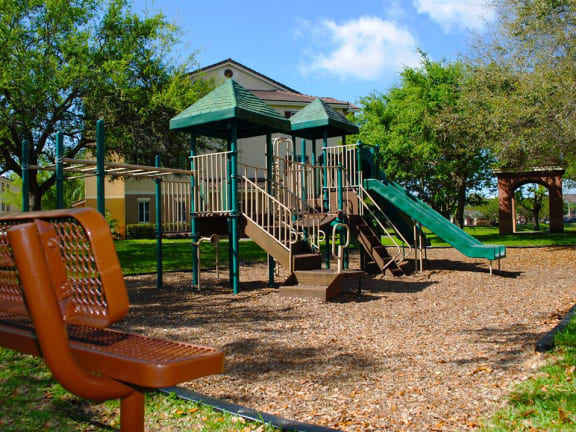Sanctuary Cove bench overlooking playground area at Sanctuary Cove, Florida, 33068