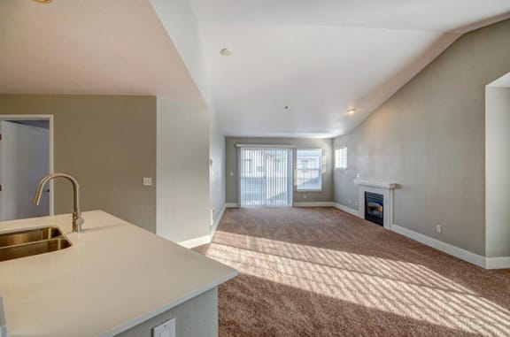 Vaulted ceilings- a view of the living room from the kitchen