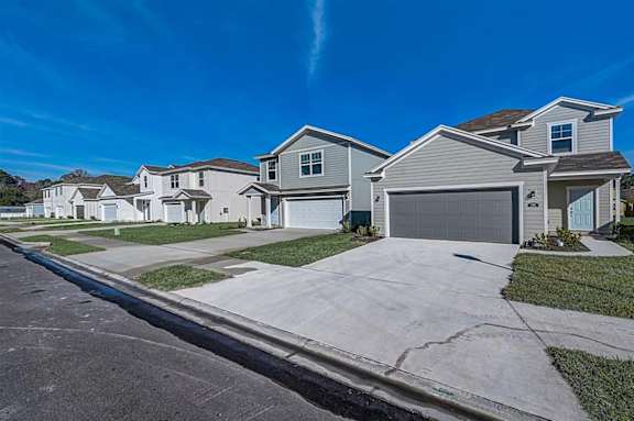 A row of houses with garages in front.