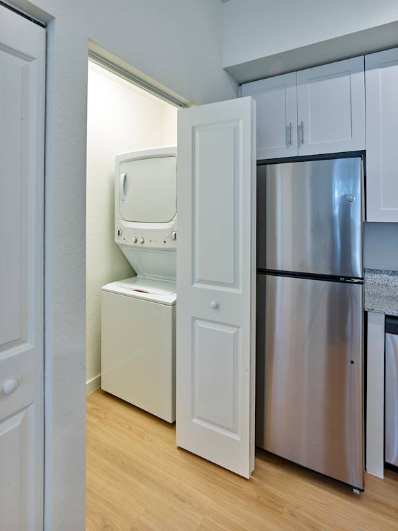 A white fridge and oven in a kitchen.