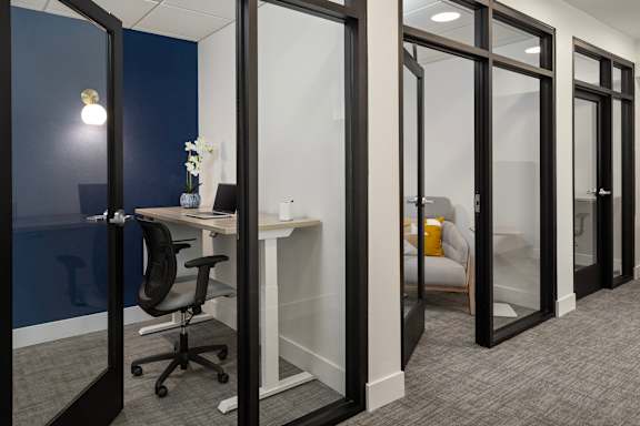 A room with a desk and a chair.