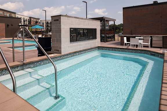 A small pool with a metal ladder.