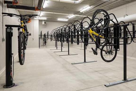 A bike rack with many bikes on it.