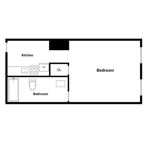 A floor plan of a small apartment with a kitchen, bathroom, and bedroom.