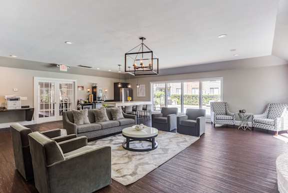 A living room with a grey couch and a coffee table.