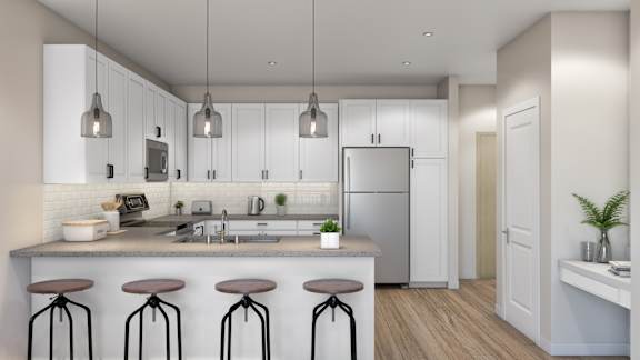 A modern kitchen with white cabinets and a central island.