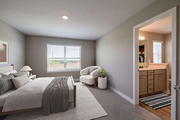 A bedroom with a bed, chair, and window.
