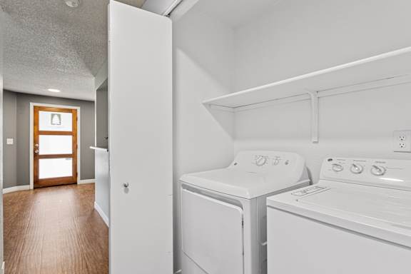 A laundry room with a washer and dryer.