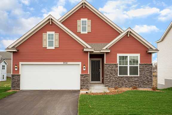 Floor Plan  A red house with a white garage door.
