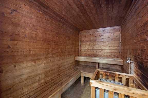 Hinton Height_Cottage Grove_MN_a sauna with wooden walls and wooden benches