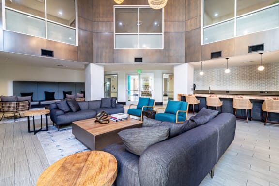 2-Bedroom Apartments in Milpitas, CA - Ilara Apartments - Lounge with Couch Seating, Bar-Top Seating, and a Kitchenette