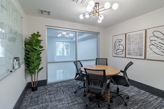 a conference room with a wooden table and chairs