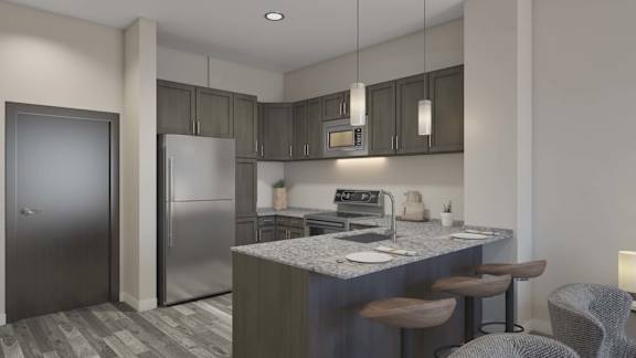 A modern kitchen with a marble countertop and stainless steel appliances.