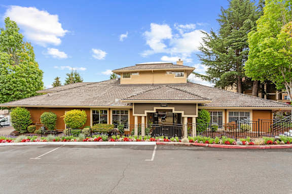 A building with a parking lot in front of it at MonteVista Apartments, Beaverton, OR