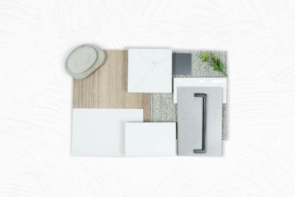 A collection of white and grey tiles and wooden planks are displayed on a white background.